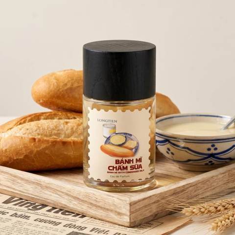 Bánh Mì Chấm Sữa eau de parfum beside a fresh baguette and condensed milk